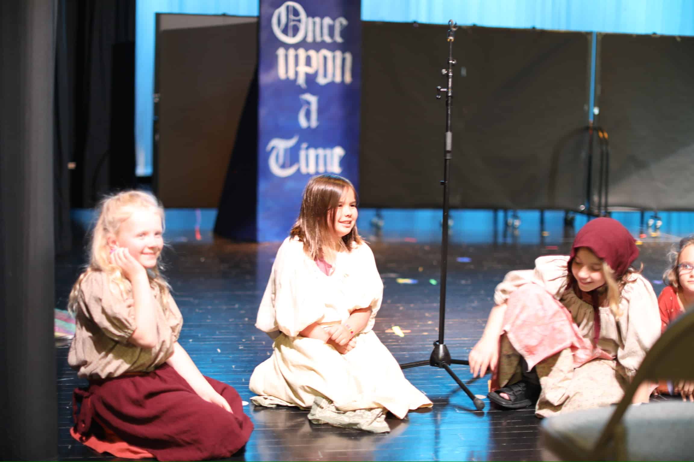 Children on a stage during a theater preformance