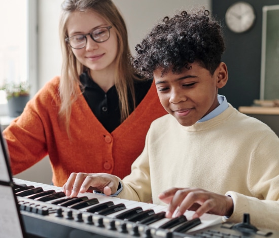 kid playing piano